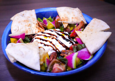 Burrata Salad heirloom tomatoes, basil pesto, candied pecans, watermelon radish, balsamic reduction, california olive oil and pita bread