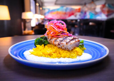 Grilled Hawaiian Swordfish saffron rice, jerk seasoned swordfish, grilled broccolini, herbed yogurt, carrot and watermelon, and radish salad