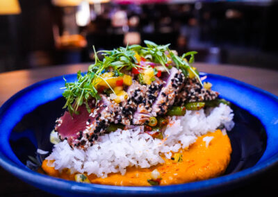 Seared Ahi Tuna sesame seared ahi, carrot ginger puree, wasabi aioli, furikaki rice, crunchy garlic green beans, pineapple salsa and micro cilantro