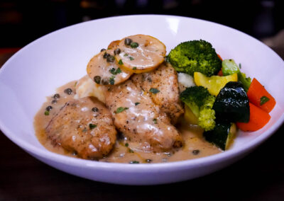 Chicken Piccata roasted garlic mashed potatoes, summer squash, broccoli, carrots and lemon caper sauce
